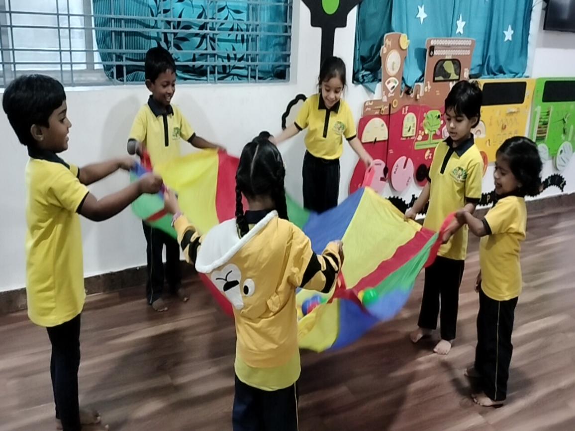 Children learning cooperation through a colourful group activity